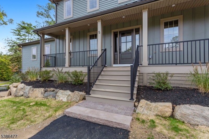 5 Percy Place Andover, NJ 07821 - Photo 5 of 50 a front view of a house with a garden