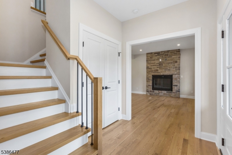 5 Percy Place Andover, NJ 07821 - Photo 7 of 50 a view of an empty room with wooden floor fireplace and a window