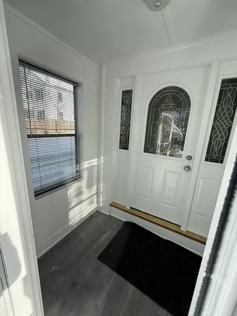 a view of entryway with a flat screen tv