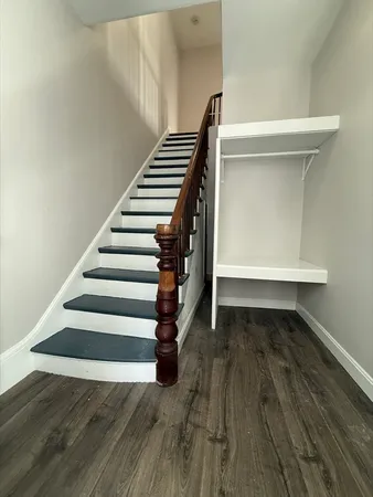 a view of entryway with wooden floor