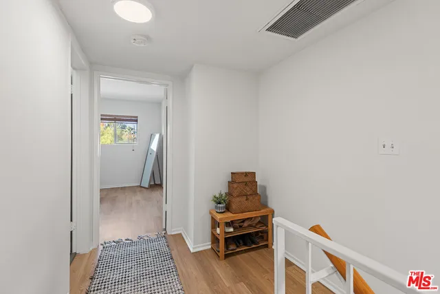 a view of a livingroom with furniture and an entryway