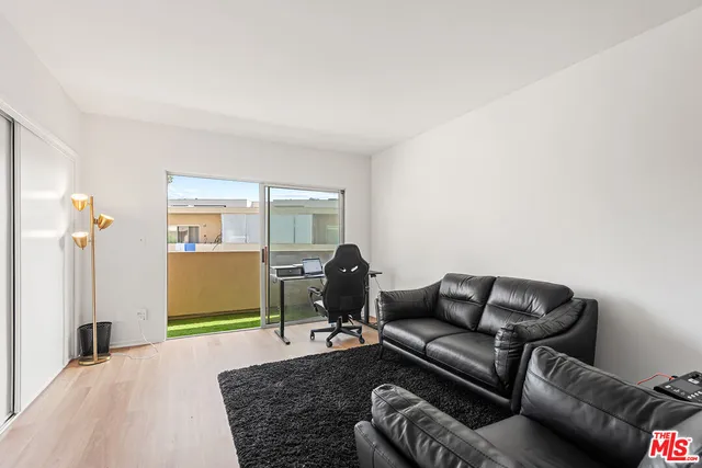 a living room with furniture rug and window