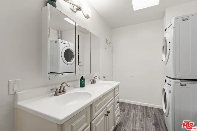a bathroom with a sink double vanity and a mirror