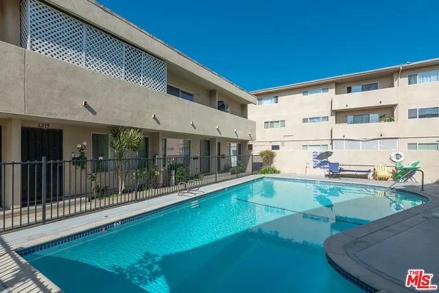 a view of a swimming pool with a patio