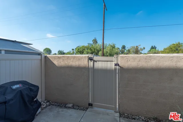a view of balcony with furniture