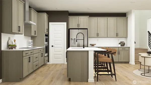a kitchen with cabinets and chairs