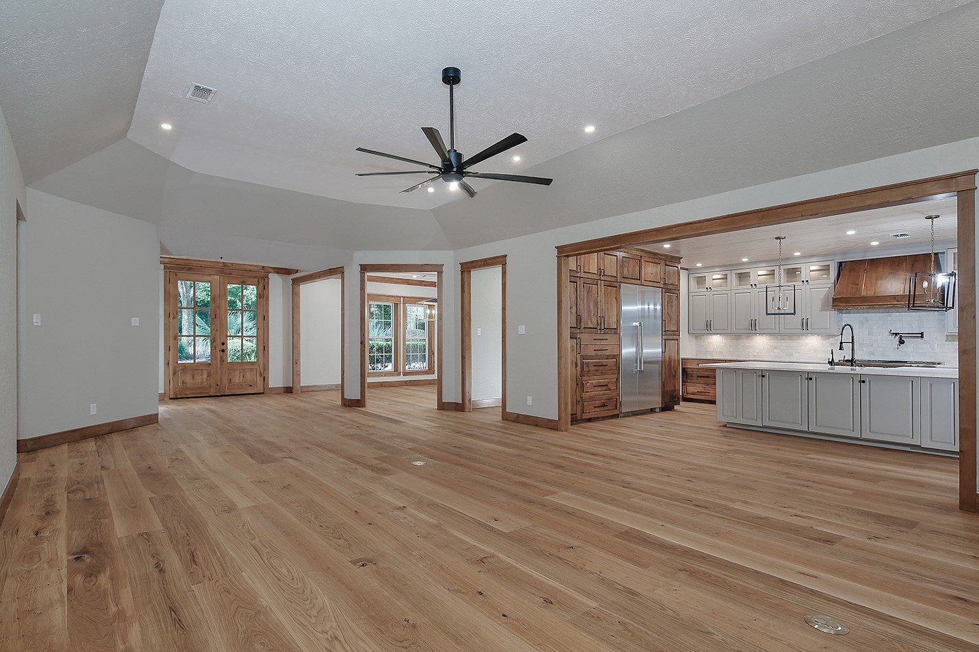 26442 McDonald Road Spring, TX 77380 - Photo 9 of 50 Living room is open to kitchen with convenient floor outlets for floating the furniture.