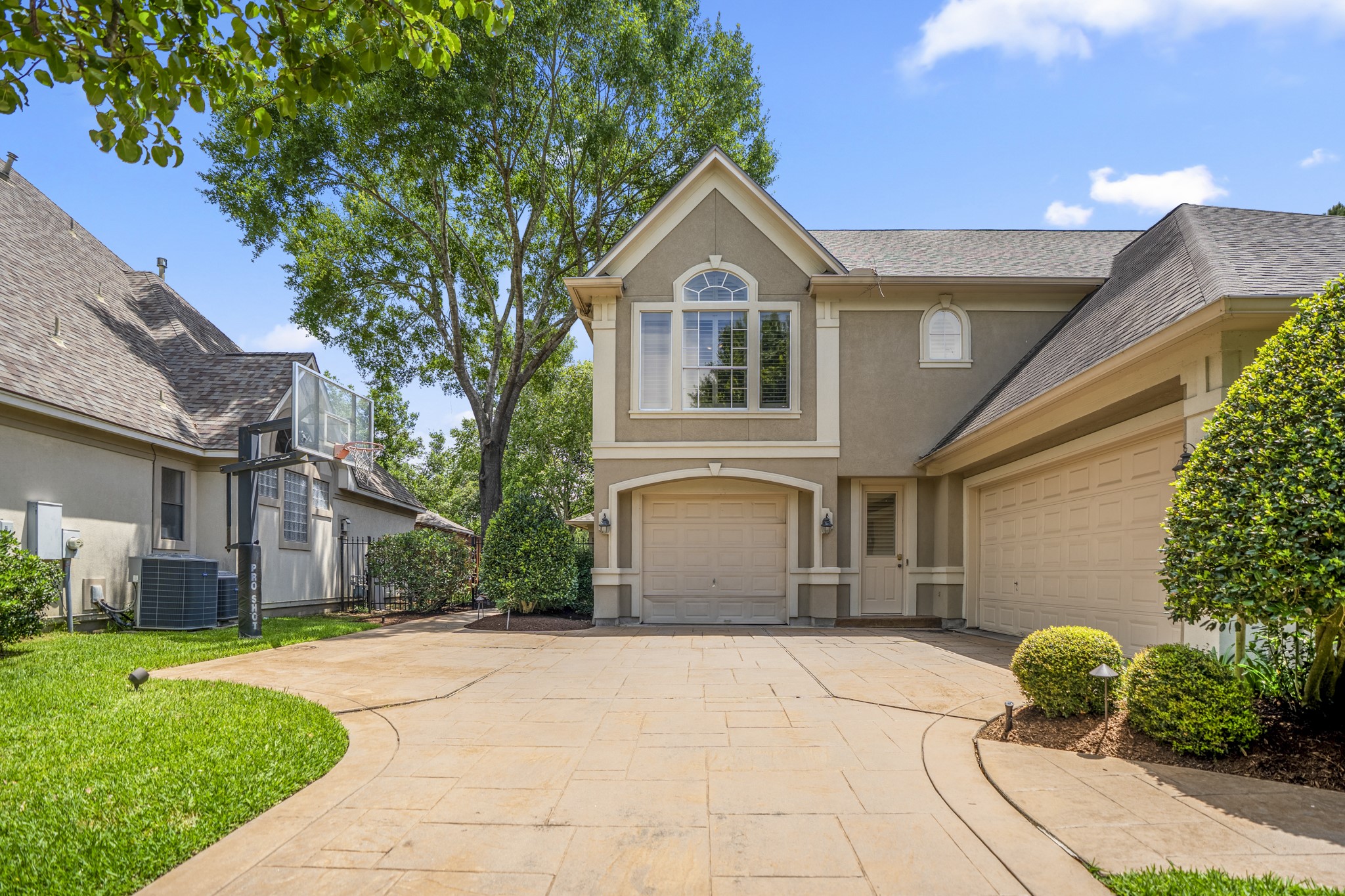 8806 Sterling Gate Circle Spring, TX 77379 - Photo 4 of 40 Stamped concrete driveway with three car garage.