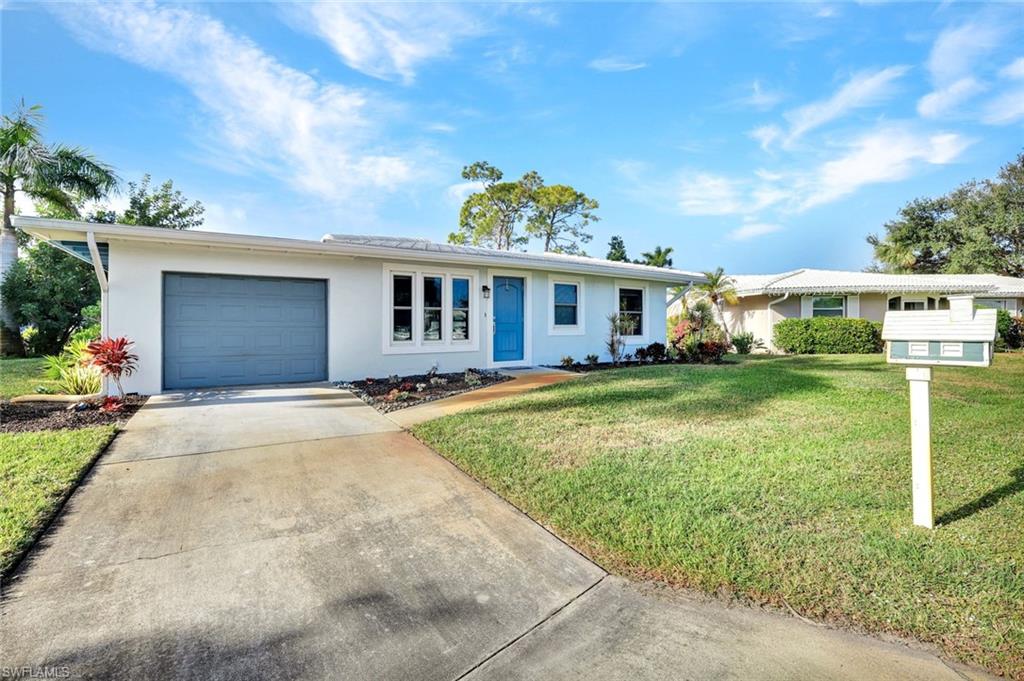 Single-family design featuring a new roof, gutters, impact windows and freshly painted.