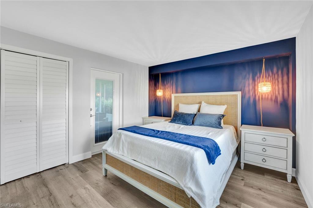 54 Hilo Court, Unit 54 Naples, FL 34112 - Photo 8 of 17 Primary bedroom with direct access to patio