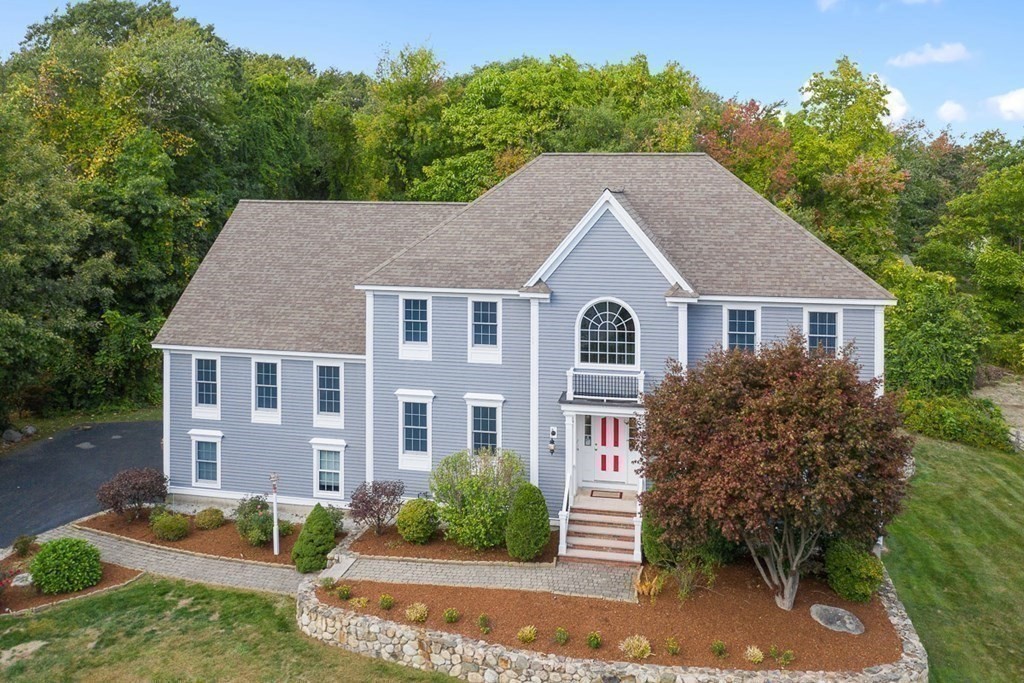 9 Sanford Road Chelmsford, MA 01824 - Photo 2 of 2 a house that has a tree in front of it