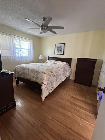 a bedroom with a bed and window