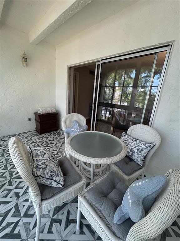 11485 Oakhurst Road, Unit 200307 Largo, FL 33774 - Photo 24 of 43 a living room with furniture and a large window