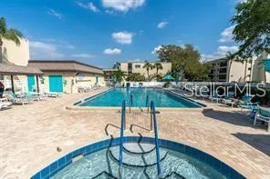 a view of swimming pool with a patio