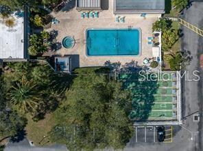11485 Oakhurst Road, Unit 200307 Largo, FL 33774 - Photo 36 of 43 an outdoor space with seating area and trees