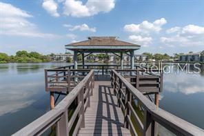11485 Oakhurst Road, Unit 200307 Largo, FL 33774 - Photo 41 of 43 a view of a lake with a deck