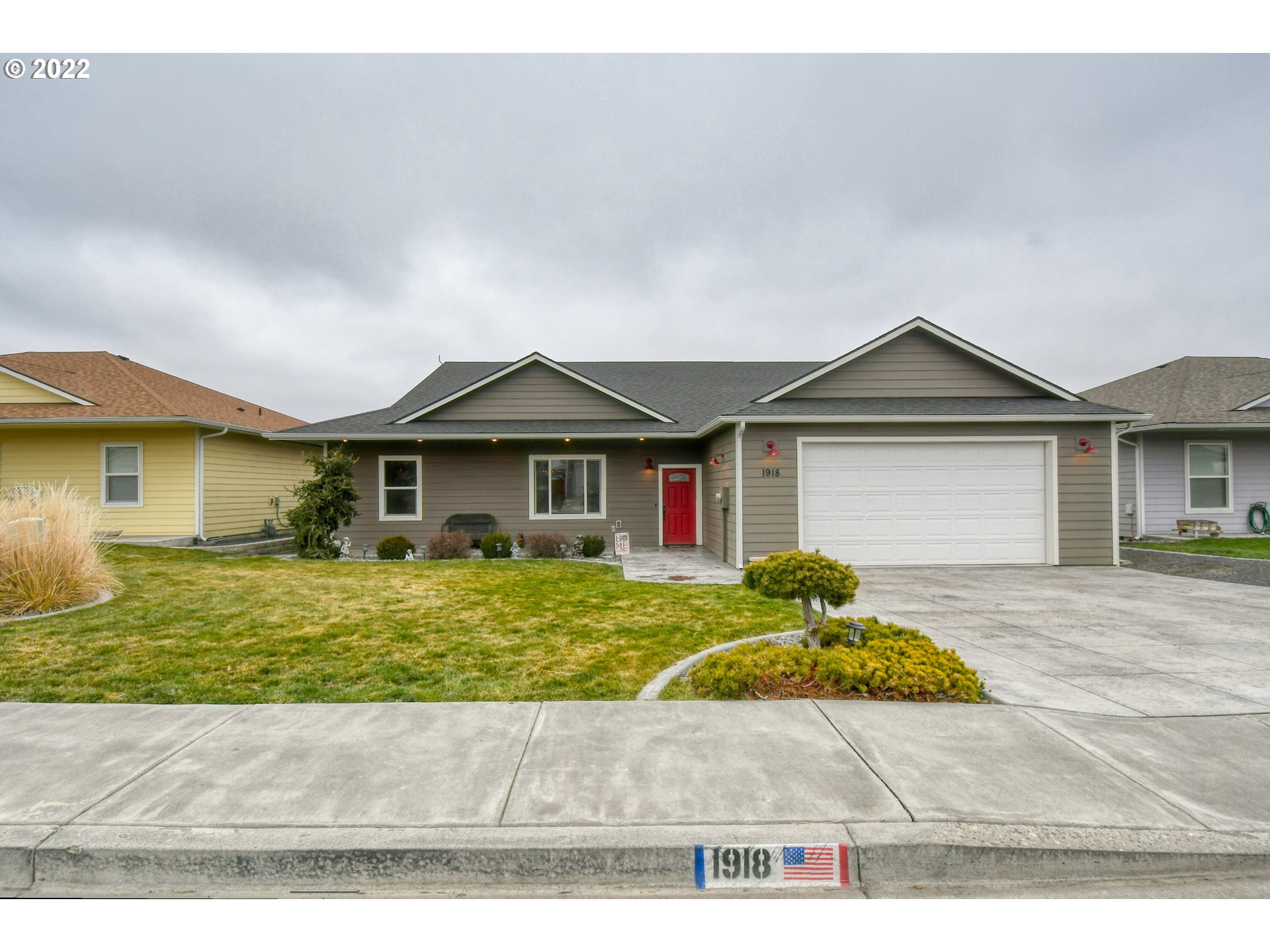 a front view of a house with a yard