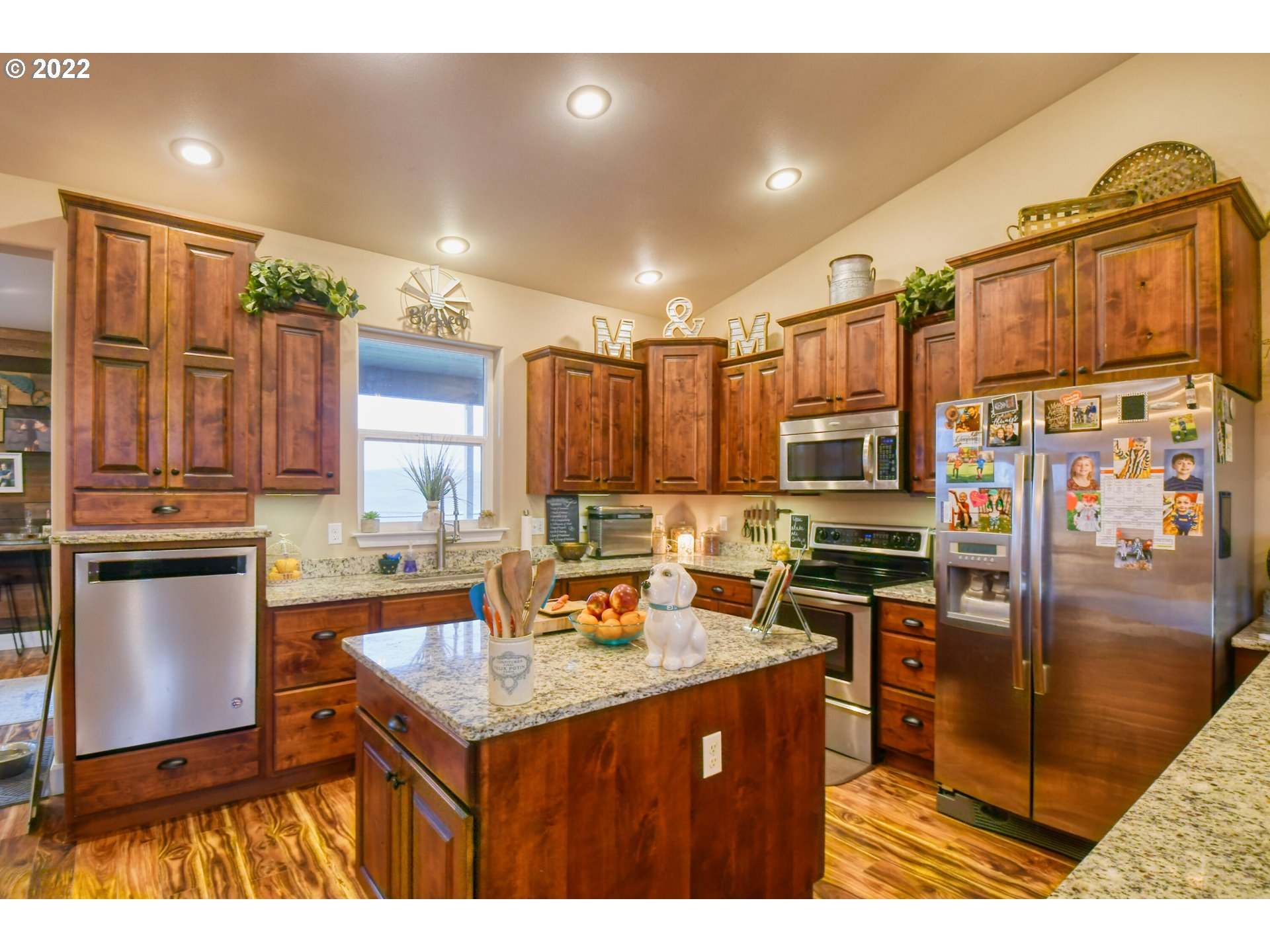 1918 Southwest 1st Street Pendleton, OR 97801 - Photo 11 of 30 a kitchen with stainless steel appliances granite countertop a sink stove and refrigerator