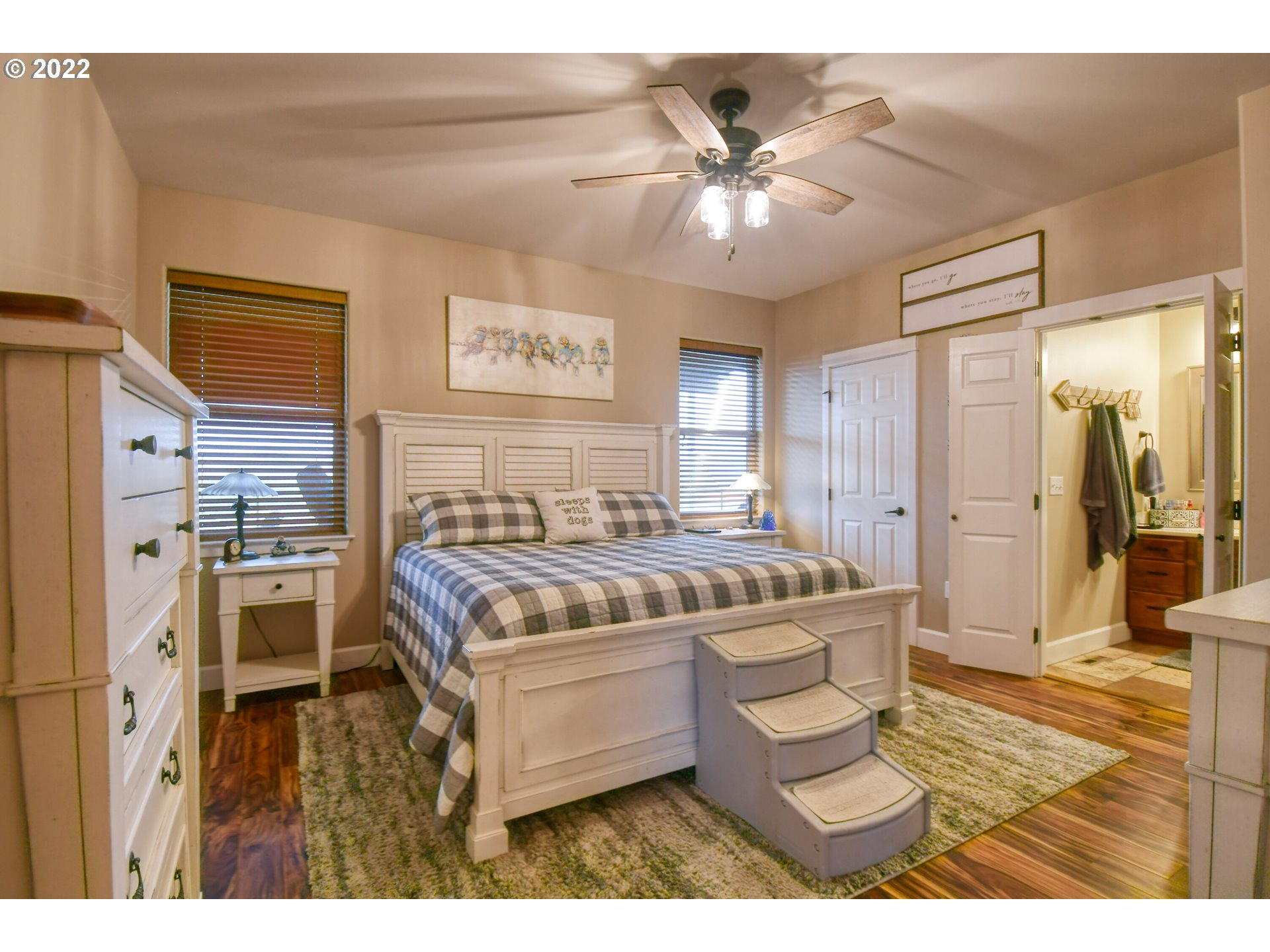 1918 Southwest 1st Street Pendleton, OR 97801 - Photo 17 of 30 a spacious bedroom with a bed and a chandelier