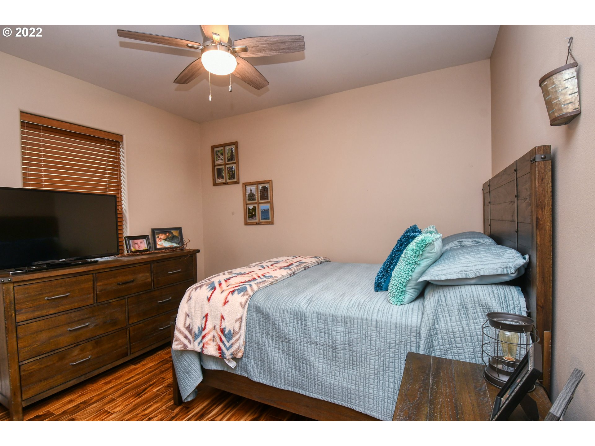 1918 Southwest 1st Street Pendleton, OR 97801 - Photo 22 of 30 a bedroom with a bed and a flat screen tv