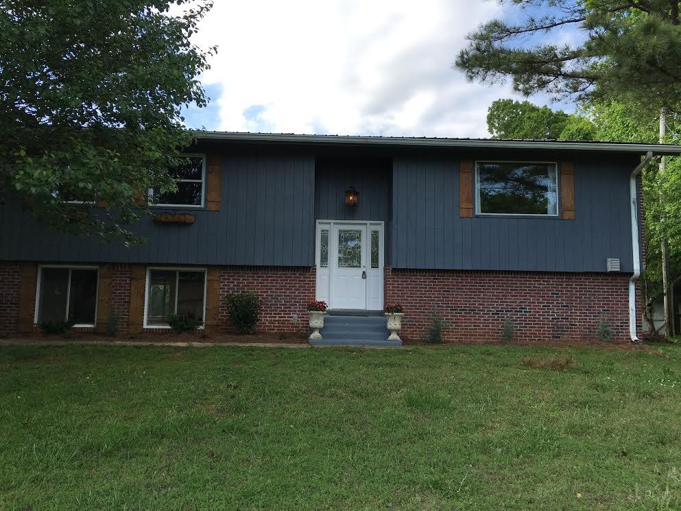 6056 Highway 76 East Springfield, TN 37172 - Photo 1 of 21 a front view of a house with garden