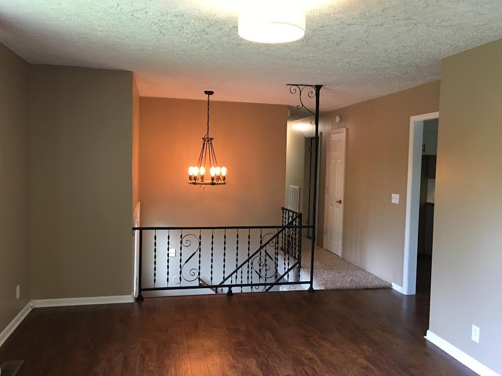 6056 Highway 76 East Springfield, TN 37172 - Photo 2 of 21 an empty room with wooden floor chandelier and entryway