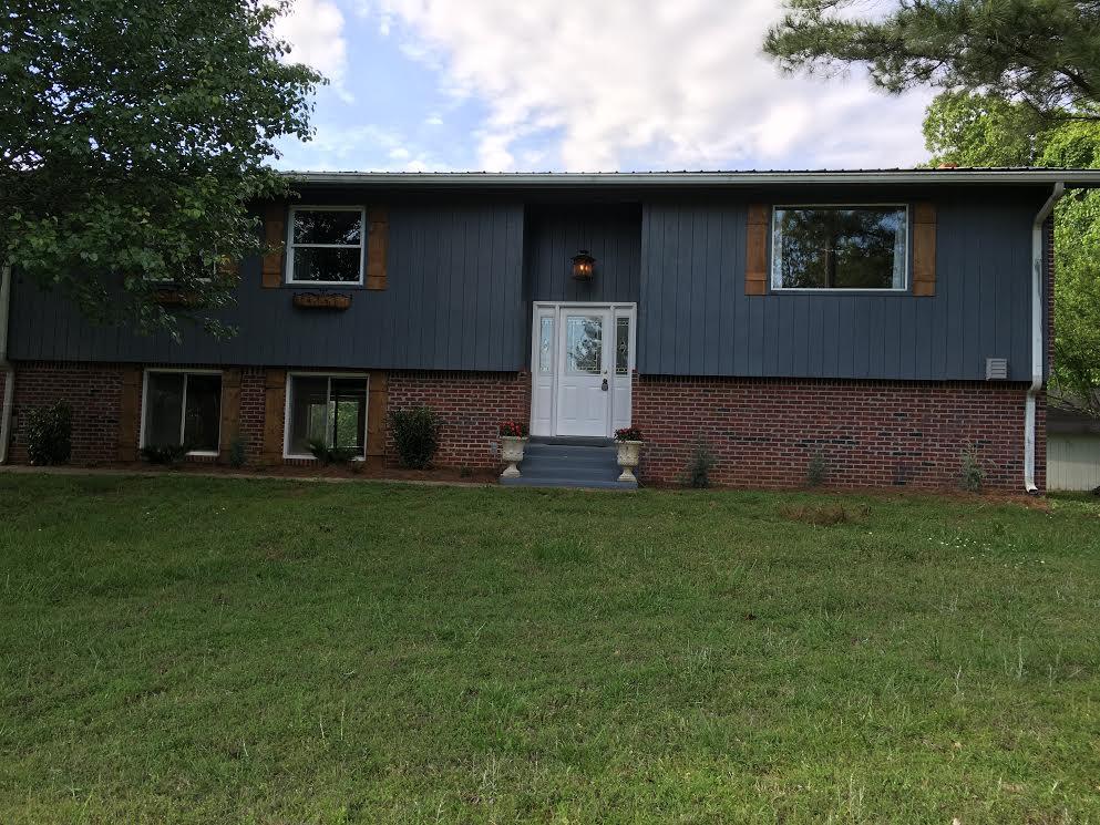 6056 Highway 76 East Springfield, TN 37172 - Photo 21 of 21 a front view of a house with a garden