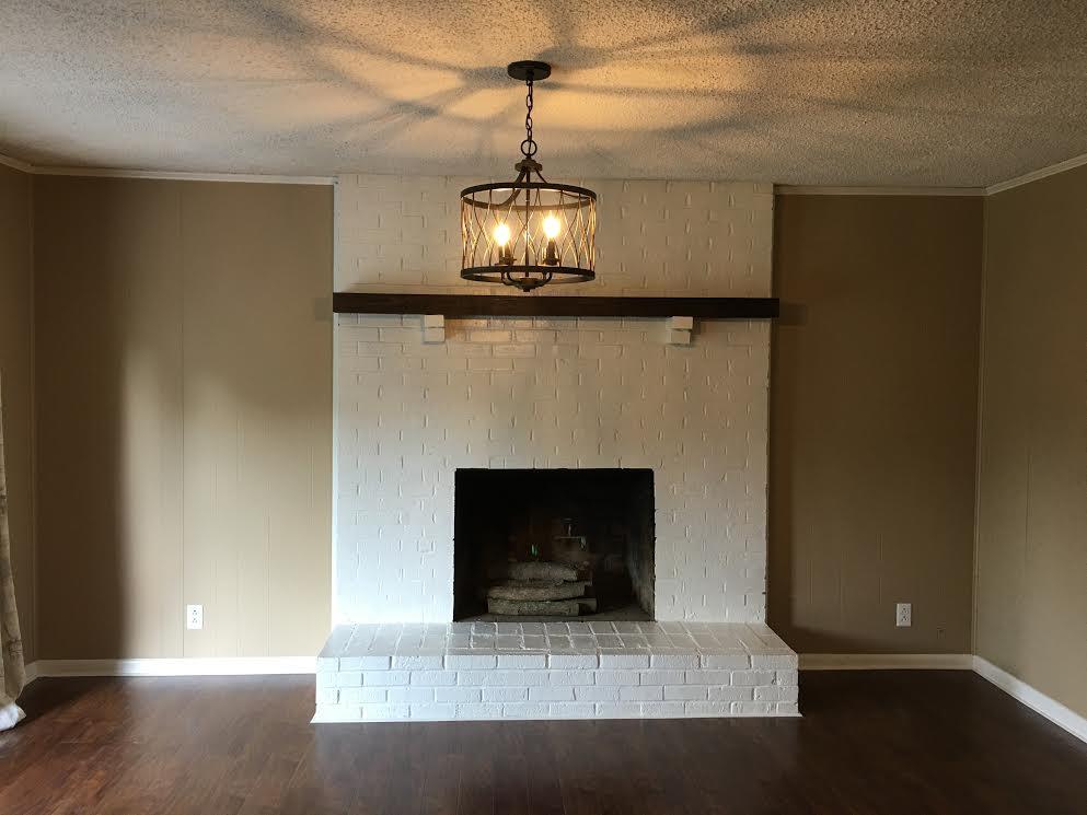 6056 Highway 76 East Springfield, TN 37172 - Photo 5 of 21 a living room with a fireplace