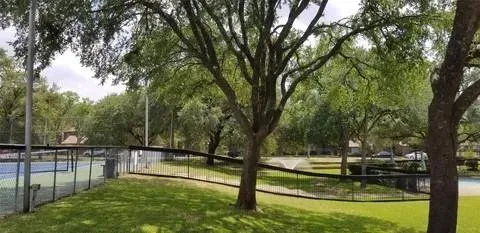 a view of a lake with a yard