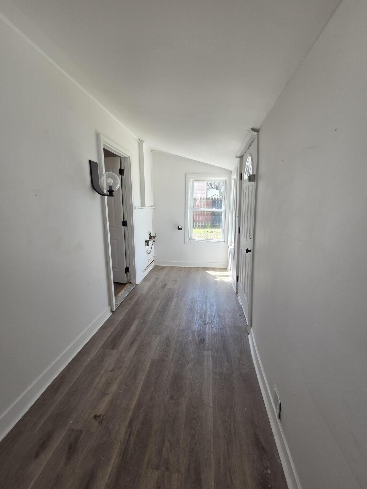 2167 Austin Street Muskegon, MI 49444 - Photo 18 of 24 Back hallway to garage and outide back y