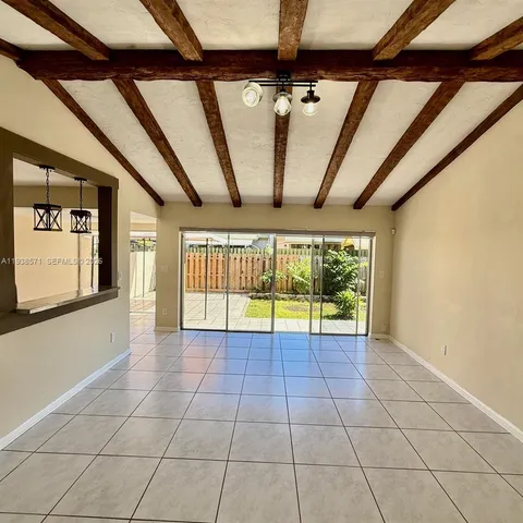 a view of an empty room with windows
