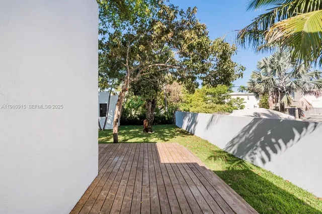 a view of a deck with a yard