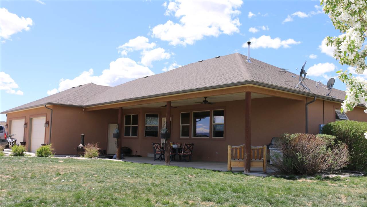 755 R Road Mack, CO 81525 - Photo 17 of 41 a backyard of a house with table and chairs