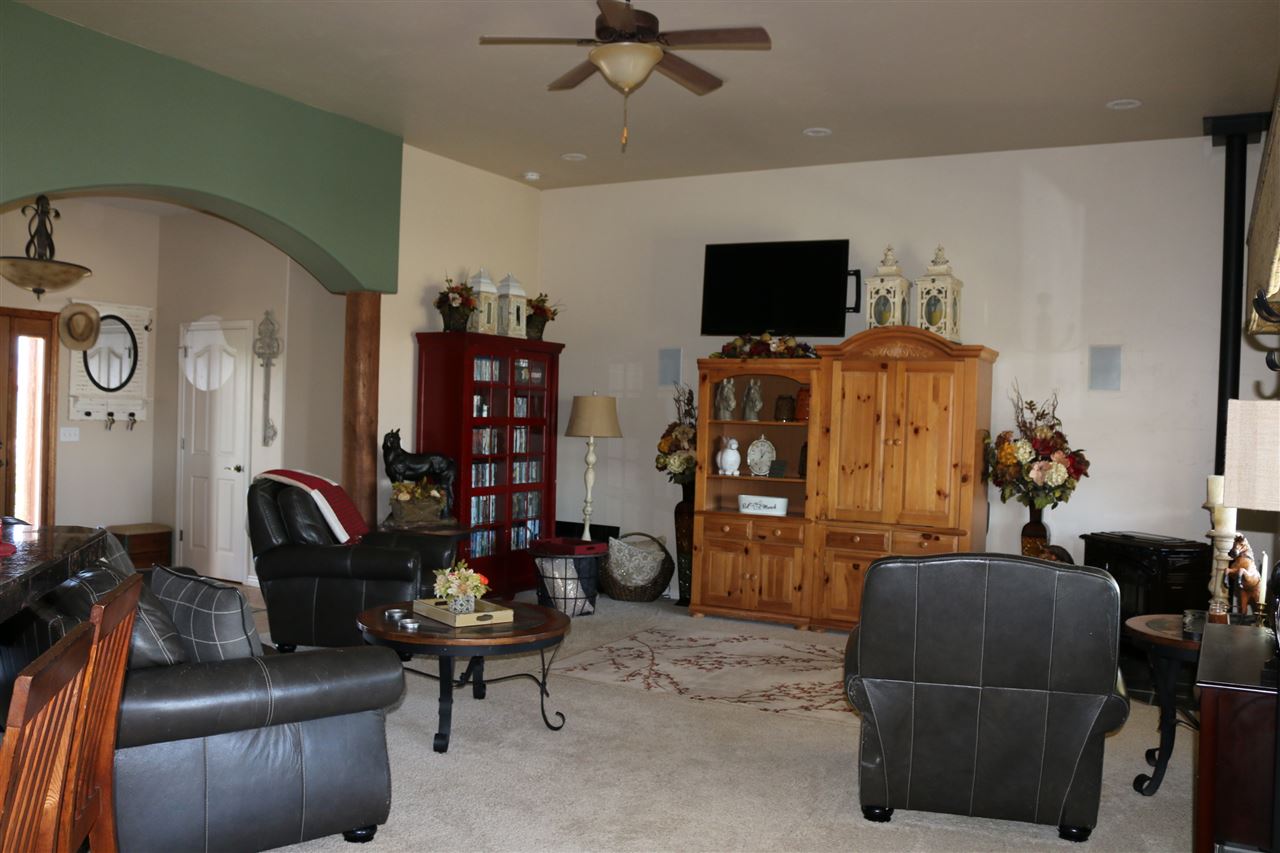 755 R Road Mack, CO 81525 - Photo 20 of 41 a living room with furniture and a flat screen tv