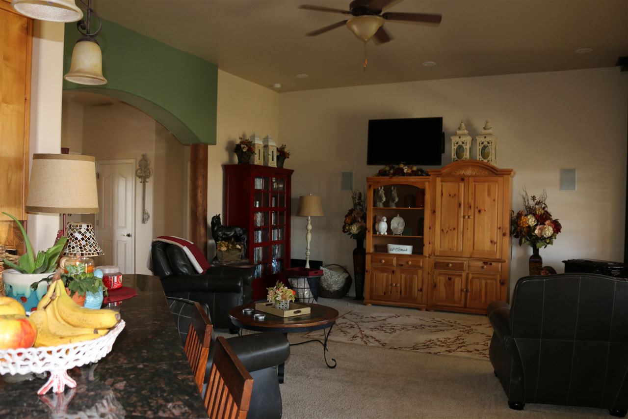 755 R Road Mack, CO 81525 - Photo 24 of 41 a living room with furniture and a flat screen tv