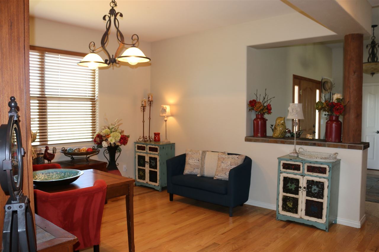 755 R Road Mack, CO 81525 - Photo 25 of 41 a living room with furniture a large window and a chandelier