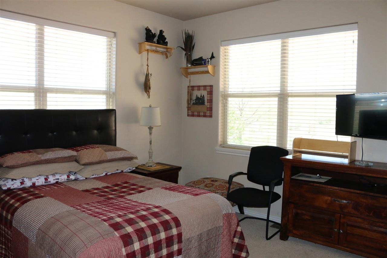 755 R Road Mack, CO 81525 - Photo 29 of 41 a bedroom with a bed and a window