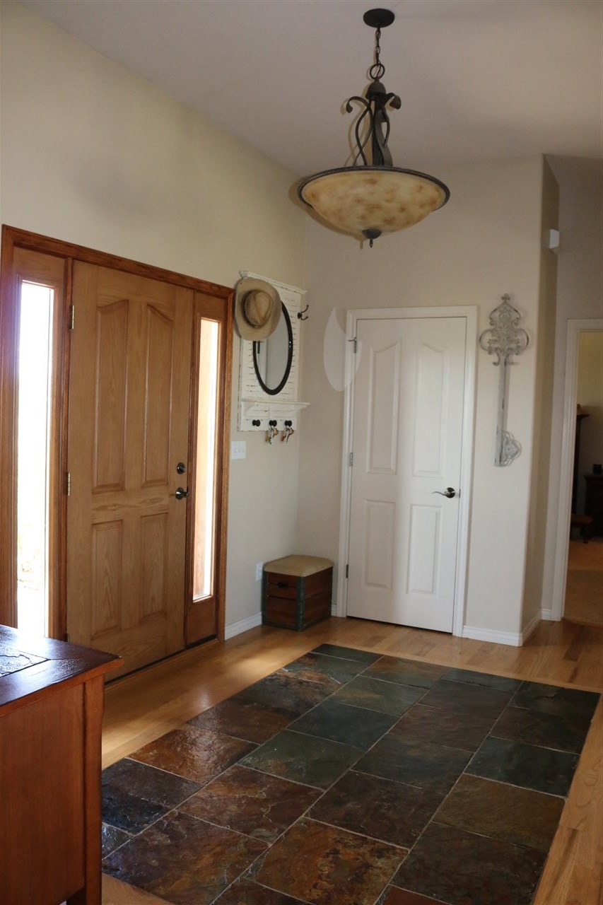 755 R Road Mack, CO 81525 - Photo 31 of 41 a view of a hallway with closet and wooden floor