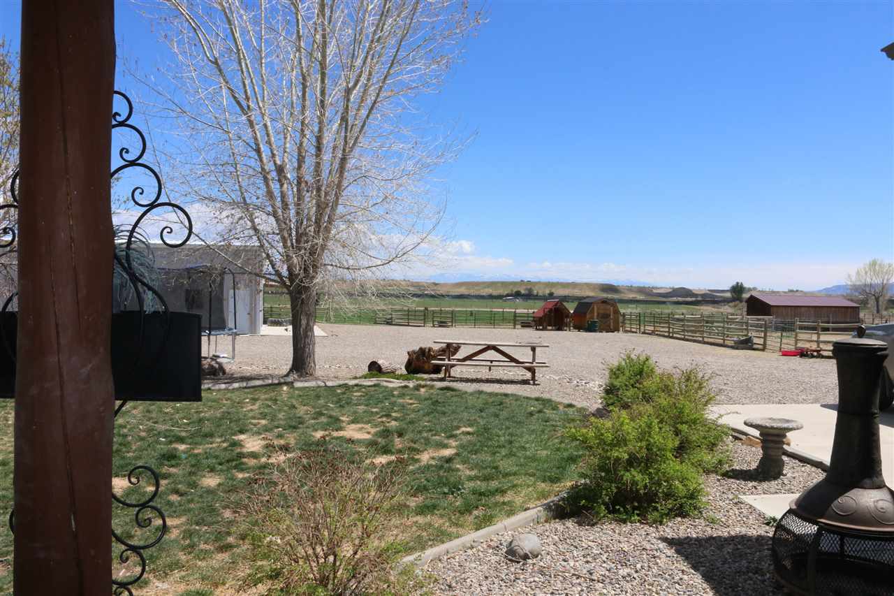 755 R Road Mack, CO 81525 - Photo 33 of 41 a view of a lake with a yard