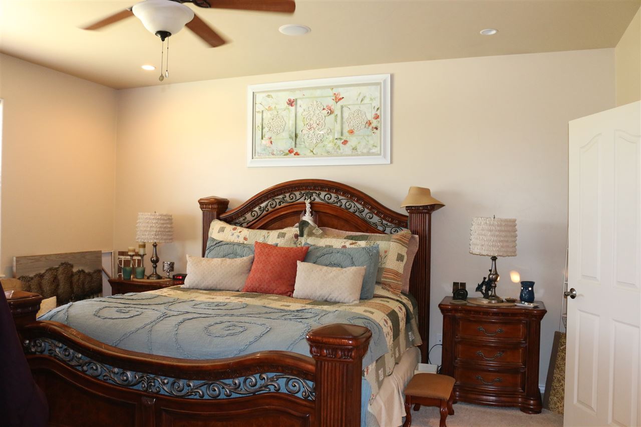 755 R Road Mack, CO 81525 - Photo 9 of 41 a bedroom with a bed and wooden floor