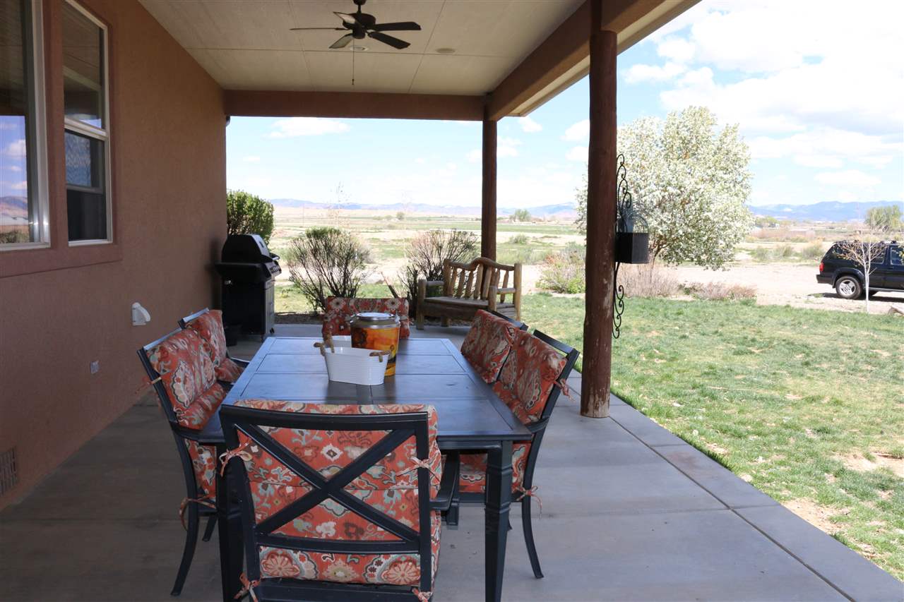 755 R Road Mack, CO 81525 - Photo 10 of 41 a outdoor dining space with furniture and garden view