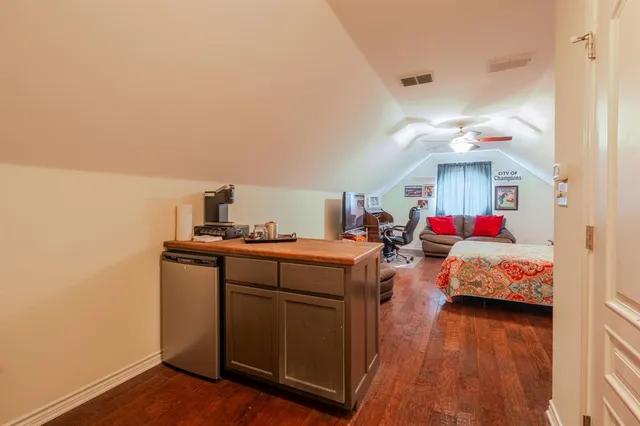 a bedroom with bed and window