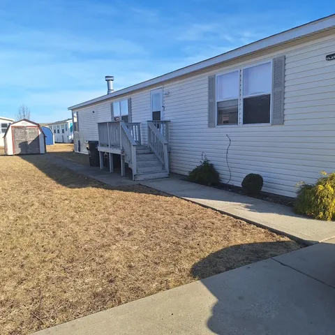 a view of swimming pool with seating space