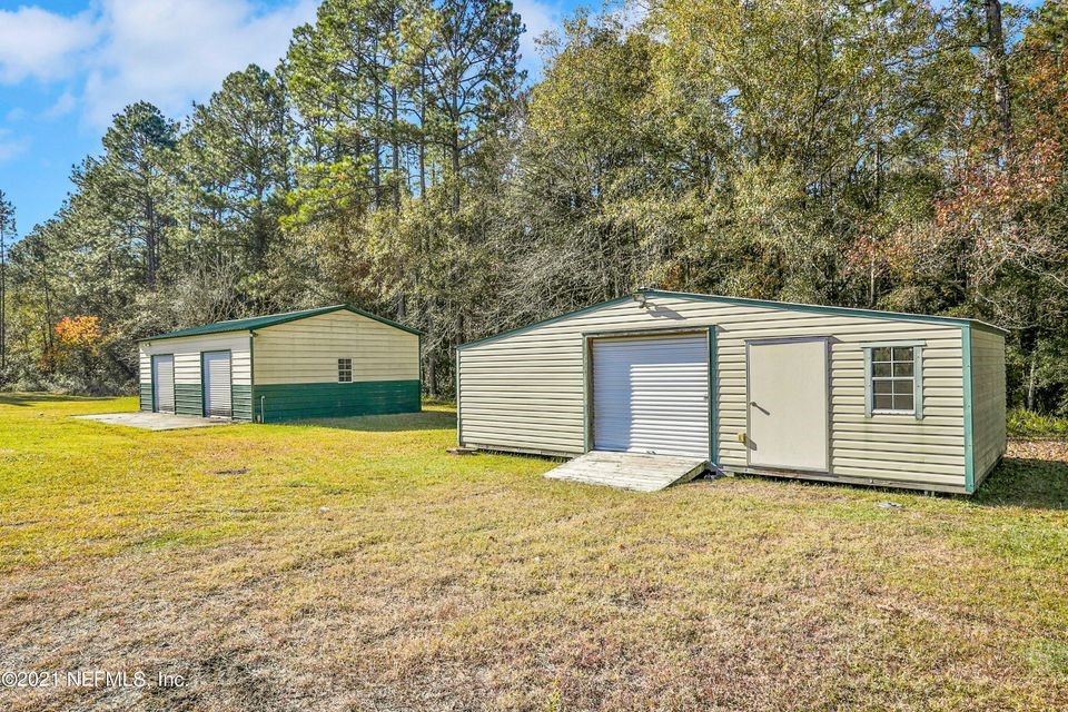 54445 Lawhon Road West Callahan, FL 32011 - Photo 4 of 6 a house with yard in front of it