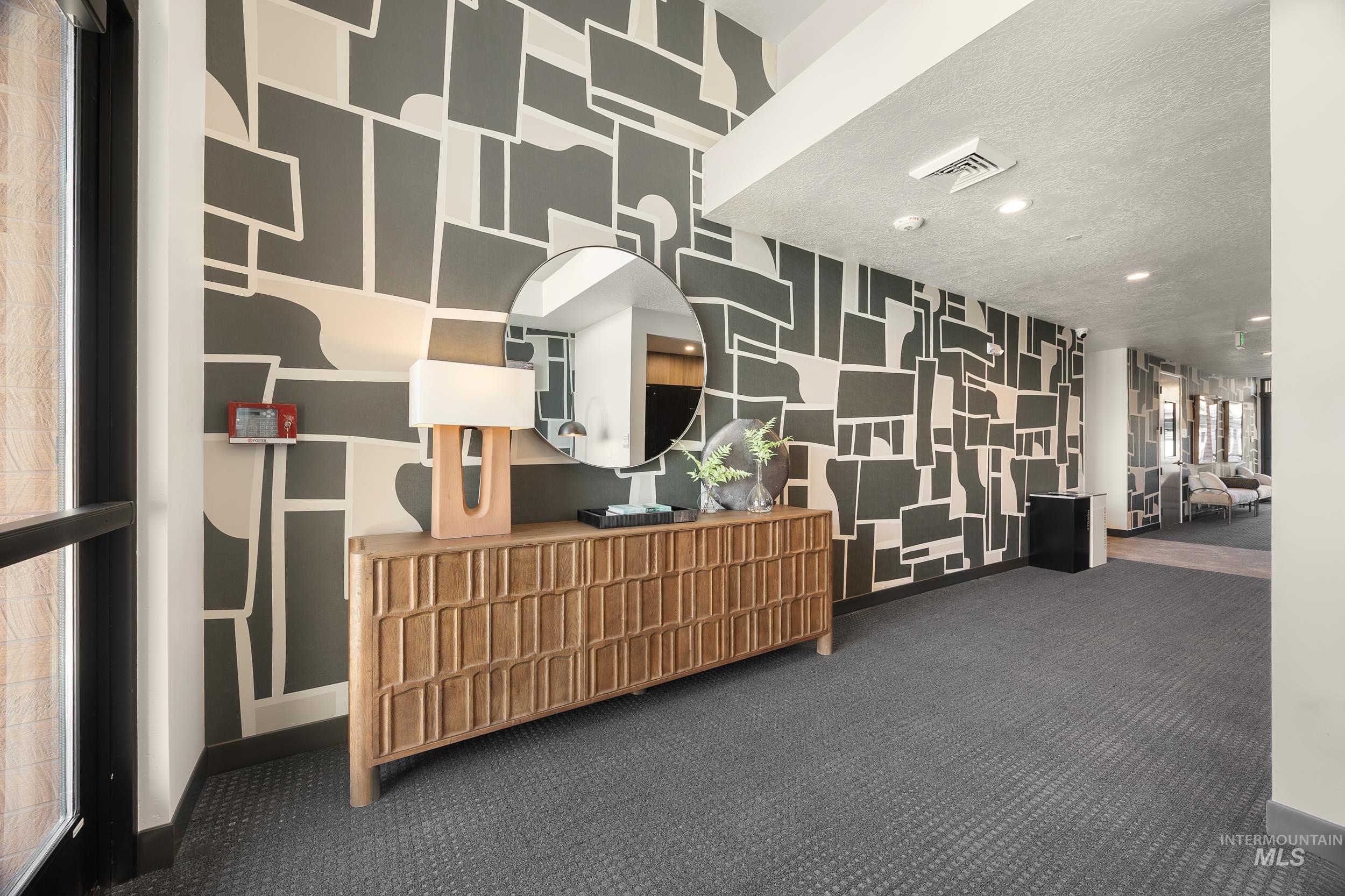4340 East Haystack Street, Unit 307 Boise, ID 83716 - Photo 26 of 50 Welcome area featuring wallpapered walls, recessed lighting, and a textured ceiling