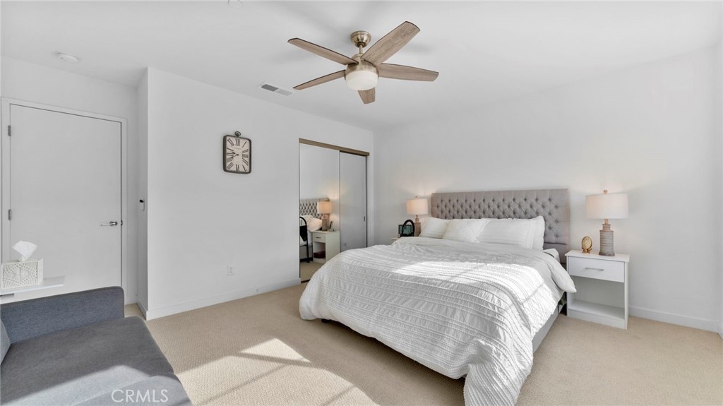 104 Lipizzan Lane Fallbrook, CA 92028 - Photo 15 of 53 a bedroom with a bed and a ceiling fan
