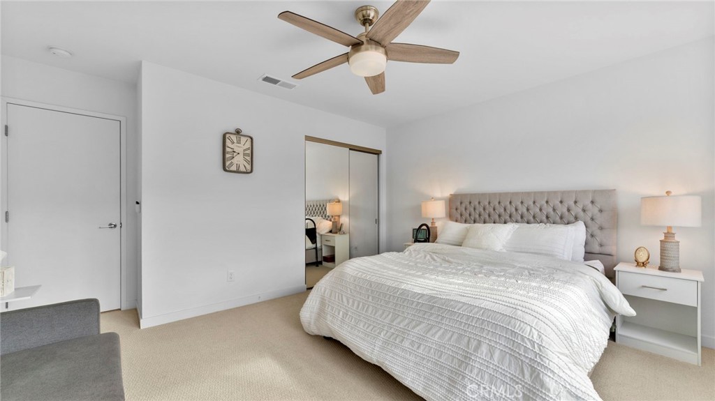 104 Lipizzan Lane Fallbrook, CA 92028 - Photo 16 of 53 a bedroom with a bed and a ceiling fan