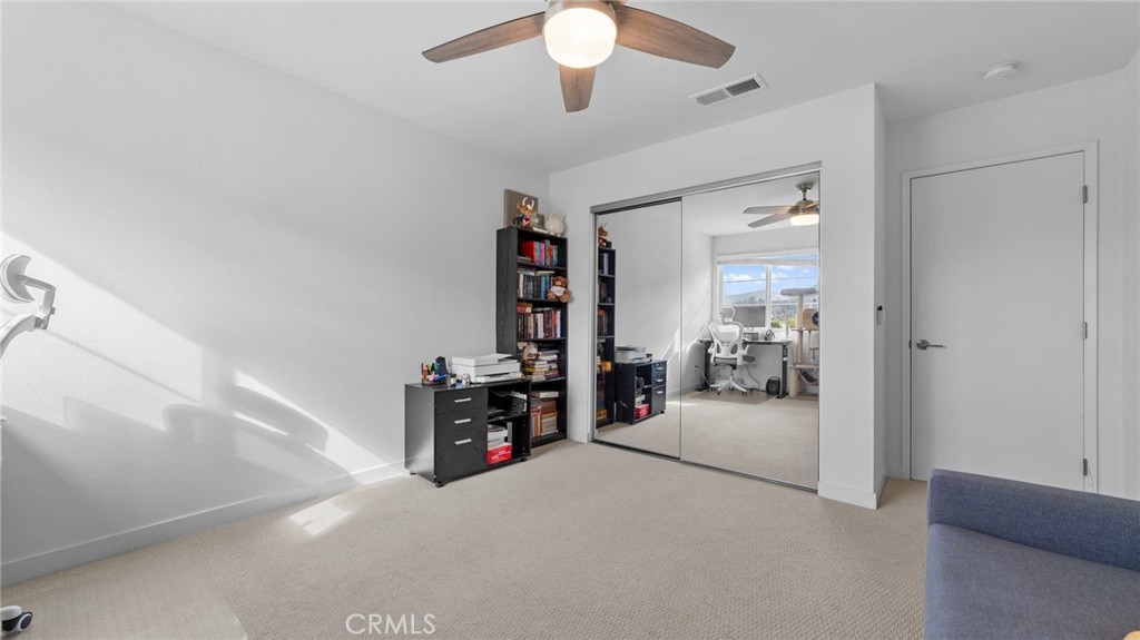 104 Lipizzan Lane Fallbrook, CA 92028 - Photo 21 of 53 a view of a livingroom with a chandelier furniture and a ceiling fan