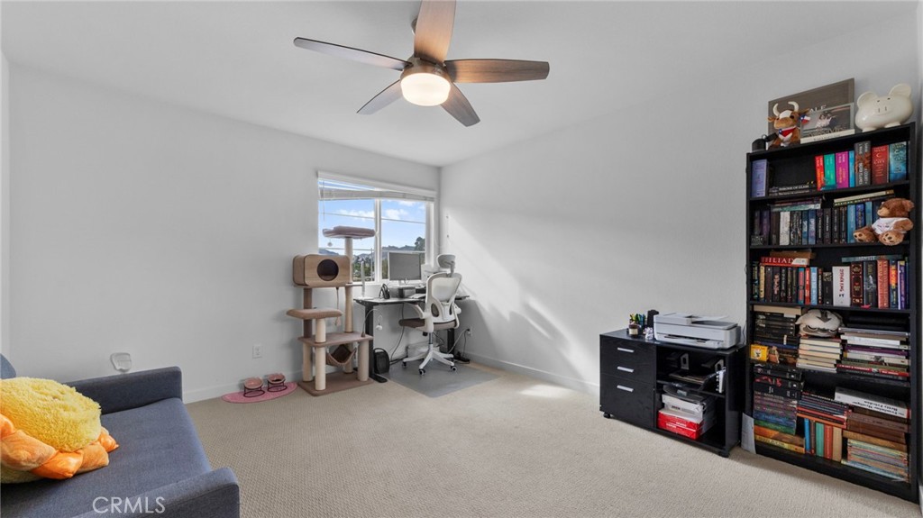 104 Lipizzan Lane Fallbrook, CA 92028 - Photo 22 of 53 a view of a livingroom with furniture and a fan