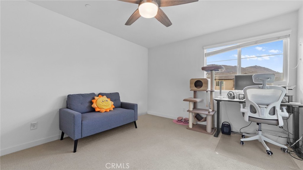 104 Lipizzan Lane Fallbrook, CA 92028 - Photo 23 of 53 a living room with furniture and a chandelier